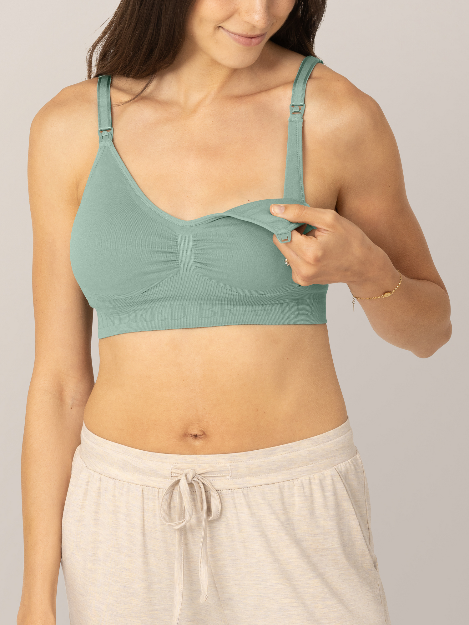 Close up of unclipping feature on the Simply Sublime® Nursing Bra in Cactus on model