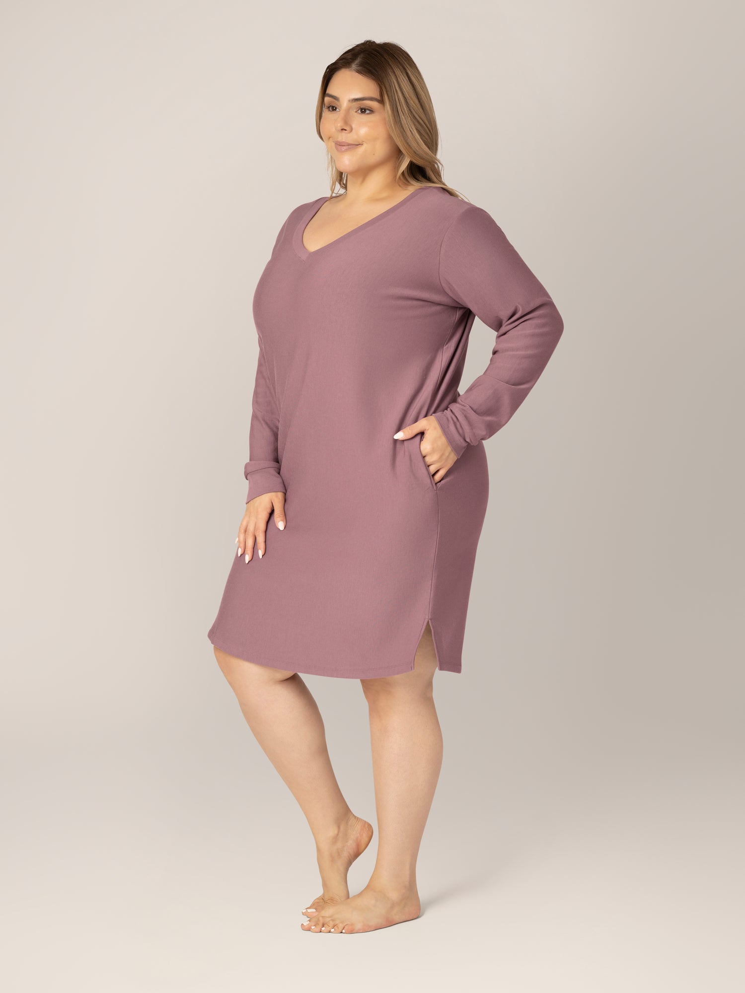 3/4 view of model wearing the Blake Oversized Maternity & Nursing Lounge Dress in Twilight, with one hand in pocket.