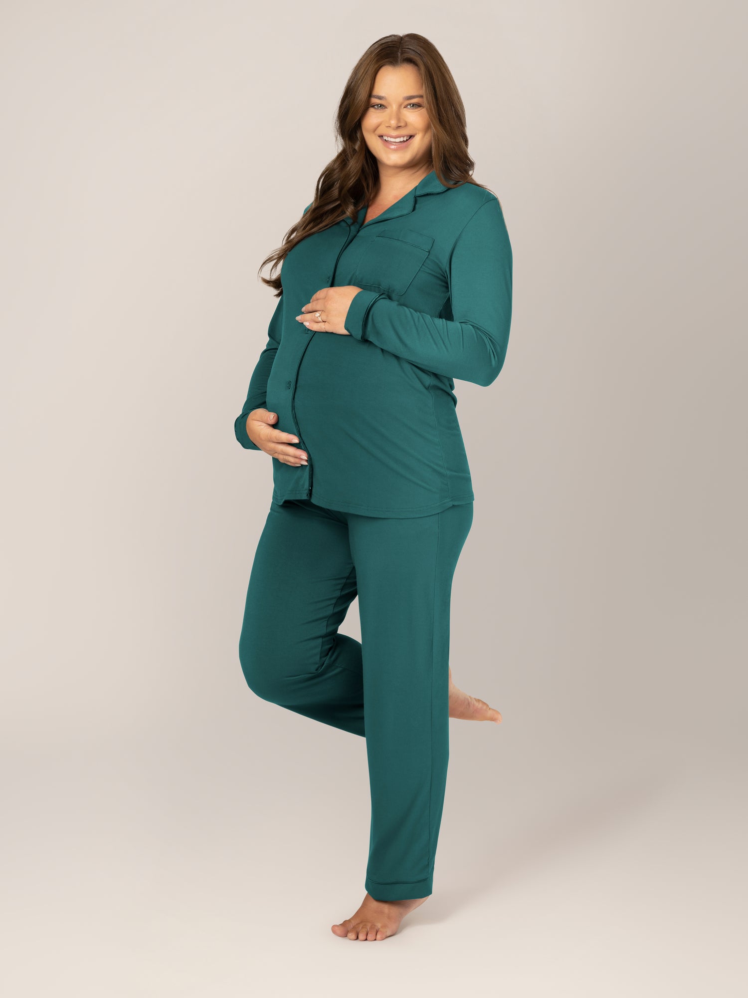 3/4 view of pregnant wearing the Clea Bamboo Long Sleeve Pajama Set in Evergreen @model_info:Dessie is 5'4" and wearing a Medium.