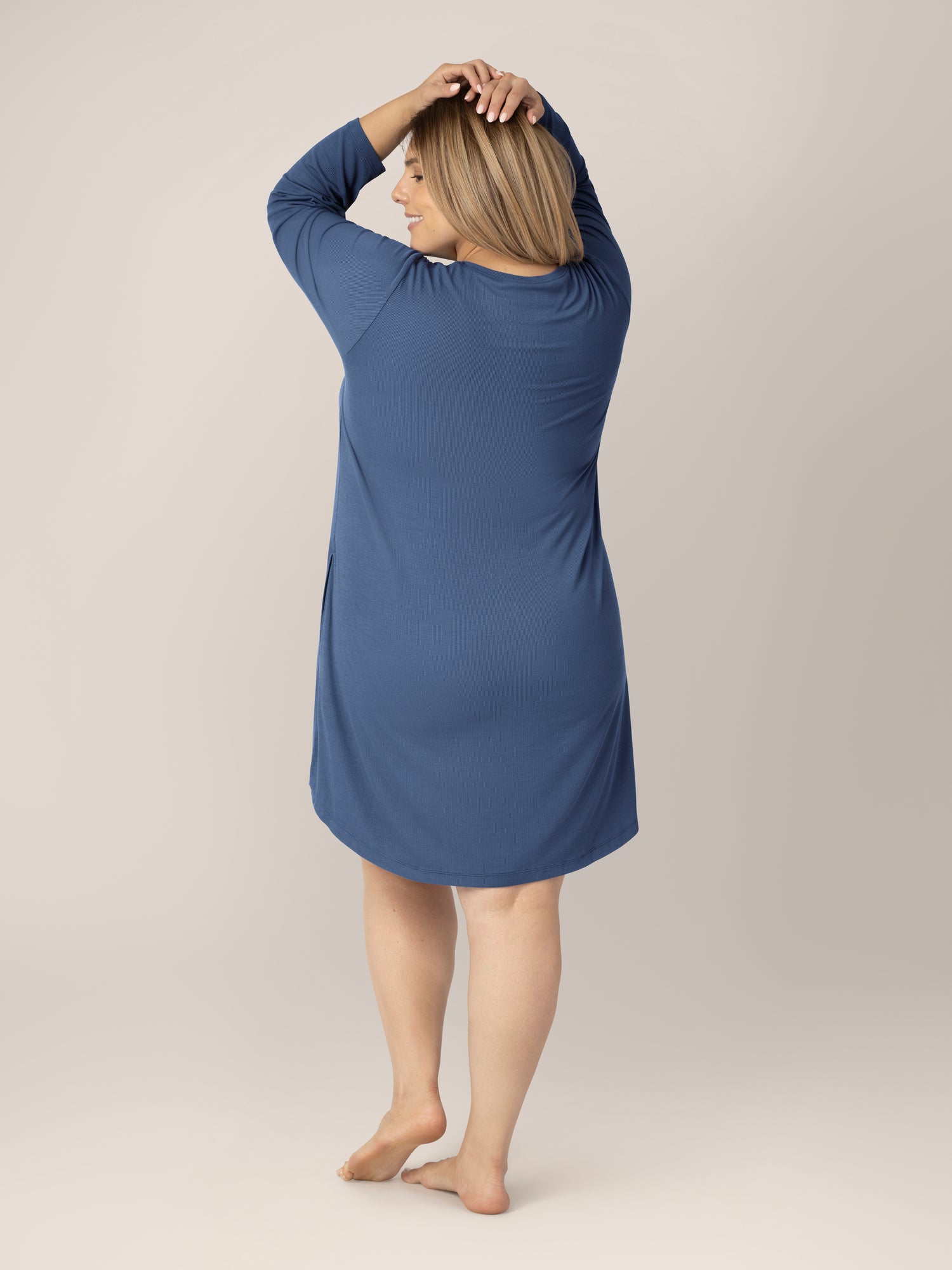 Back view of model wearing the Riley Ribbed Bamboo Maternity & Nursing Nightgown in Slate Blue. 