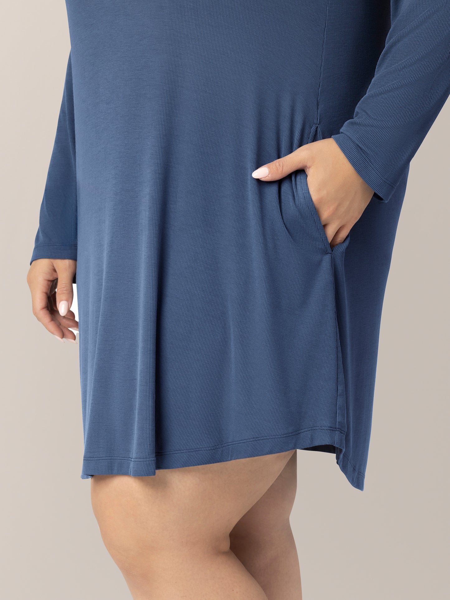 Close up of fabric, pocket and hemline on model wearing the Riley Ribbed Bamboo Maternity & Nursing Nightgown in Slate Blue, with hand in pocket.