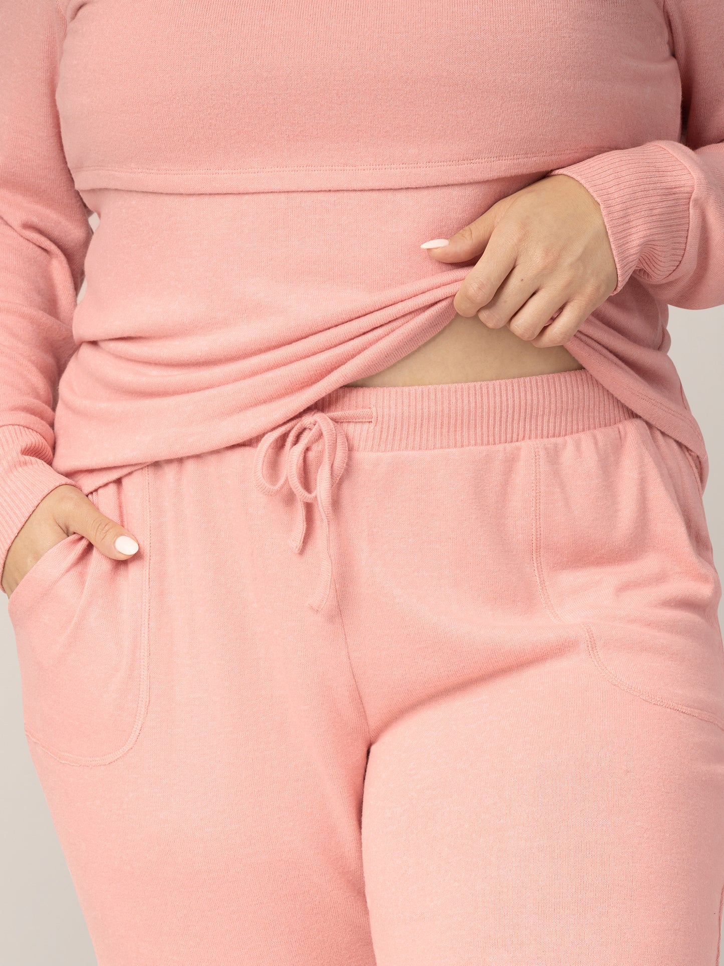 Close up of fabric, pocket, waistband and drawstring on the Zoe Nursing Pajama & Lounge Set in Rose Heather, on model