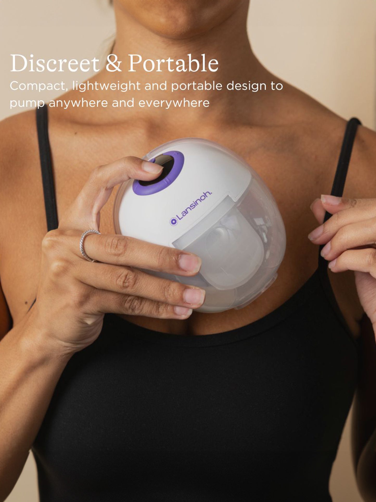 Lansinoh DiscreetDuo™ Wearable Pump being placed into top on model, noting discreet and portable | Kindred Bravely