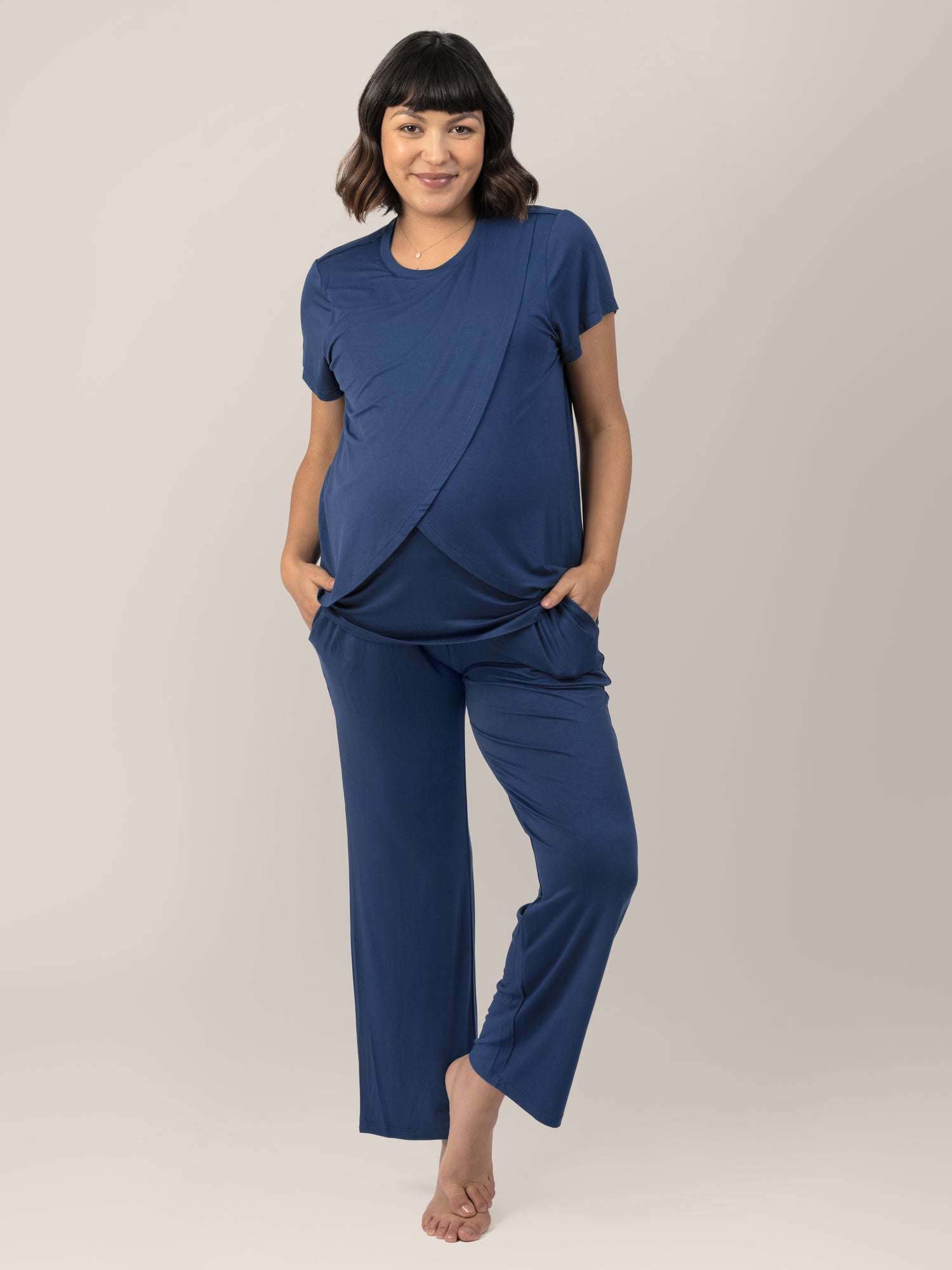 Model wearing the Tulip Hem Maternity and Nursing Pajama Set in Navy. @model_info: Brittani is wearing a Medium.