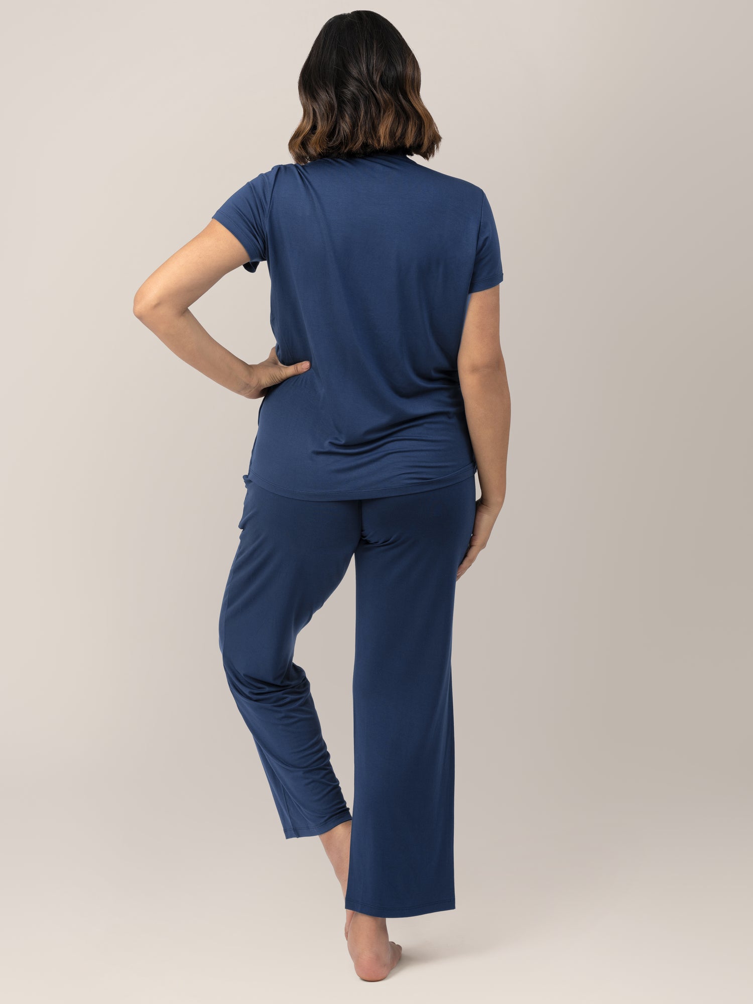 Back view of Model wearing the Tulip Hem Maternity and Nursing Pajama Set. 