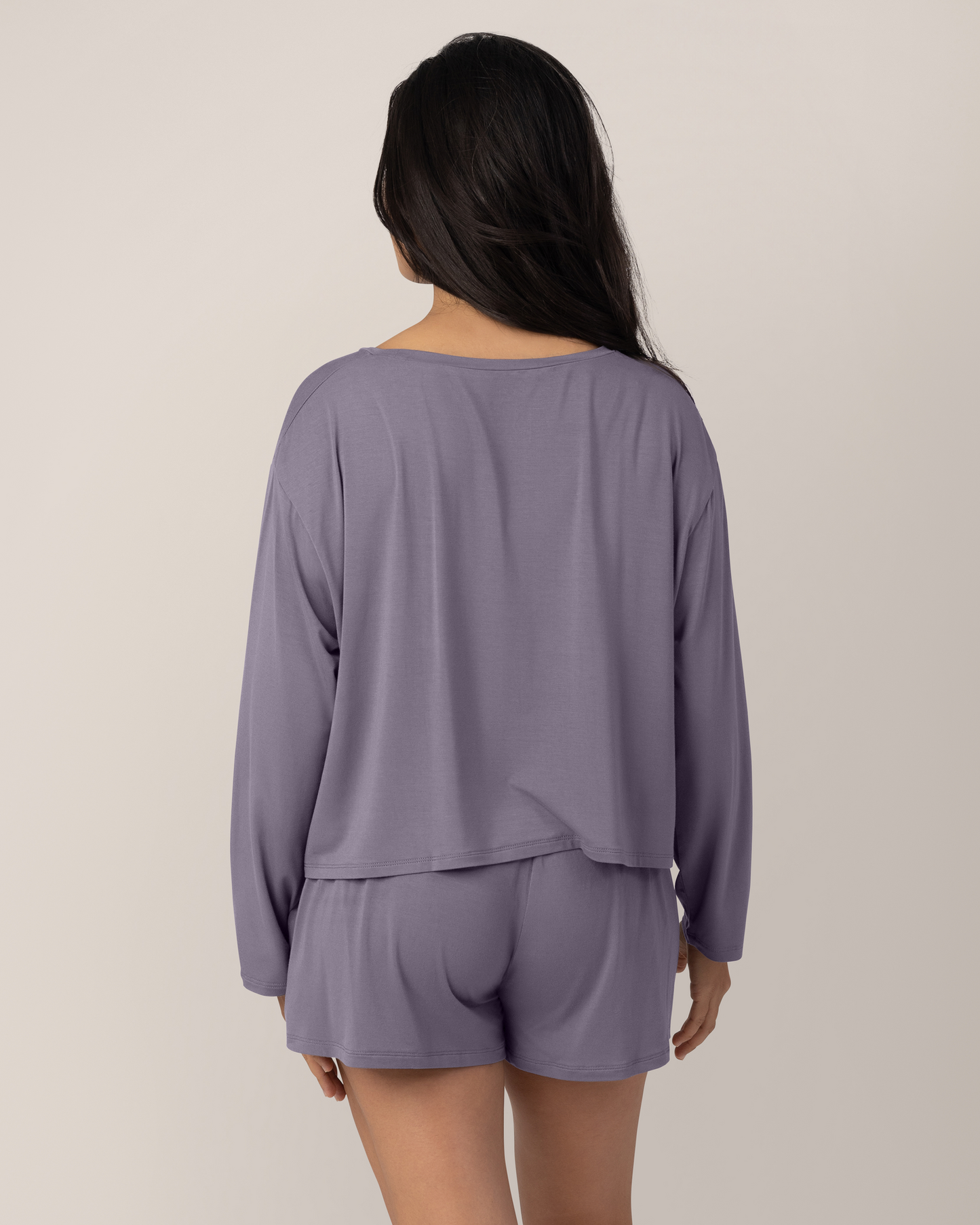 Back view of model wearing the Aria Bamboo Casual Cropped Long Sleeve Top in Granite