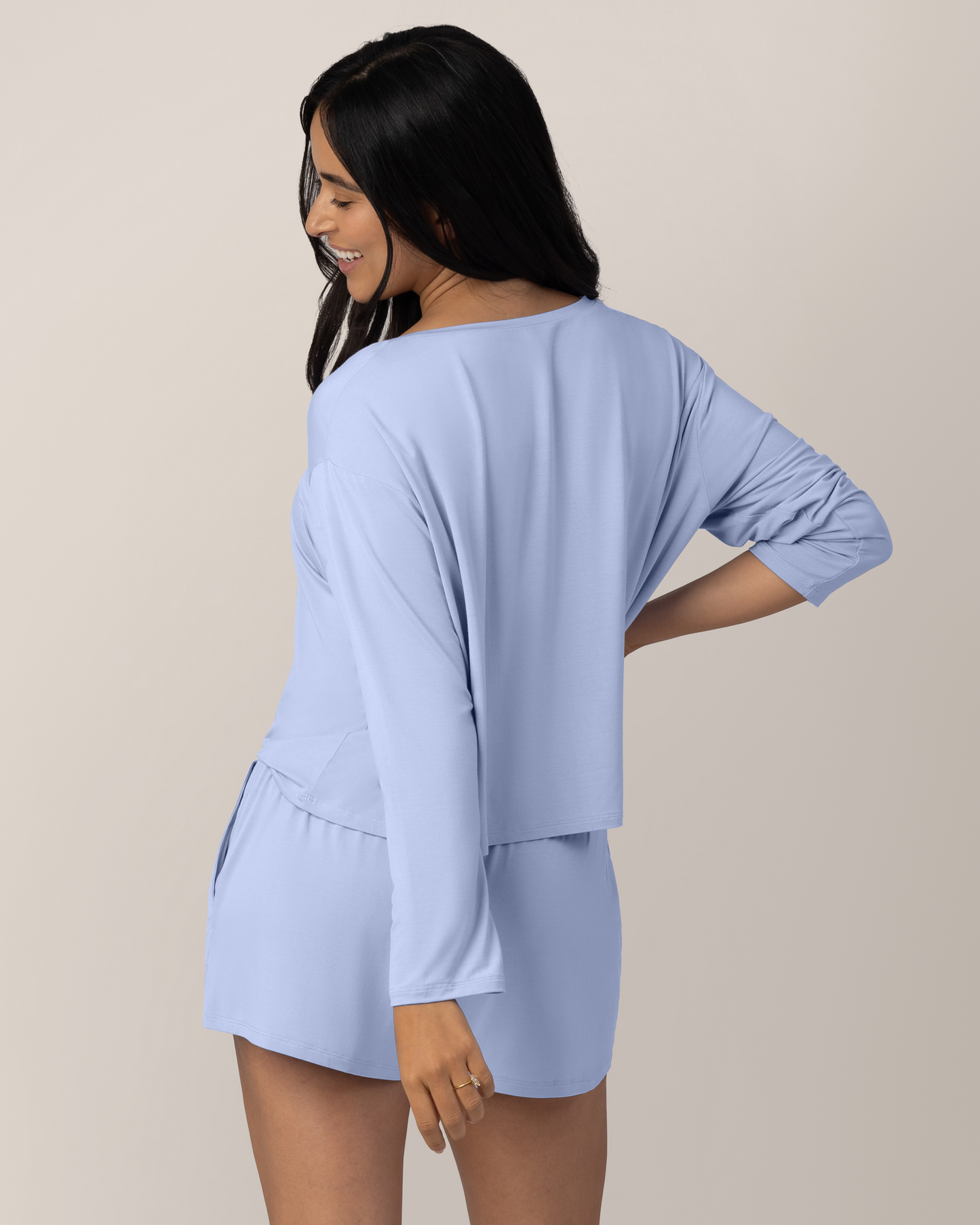 Back view of model wearing the Aria Bamboo Casual Cropped Long Sleeve Top in Periwinkle