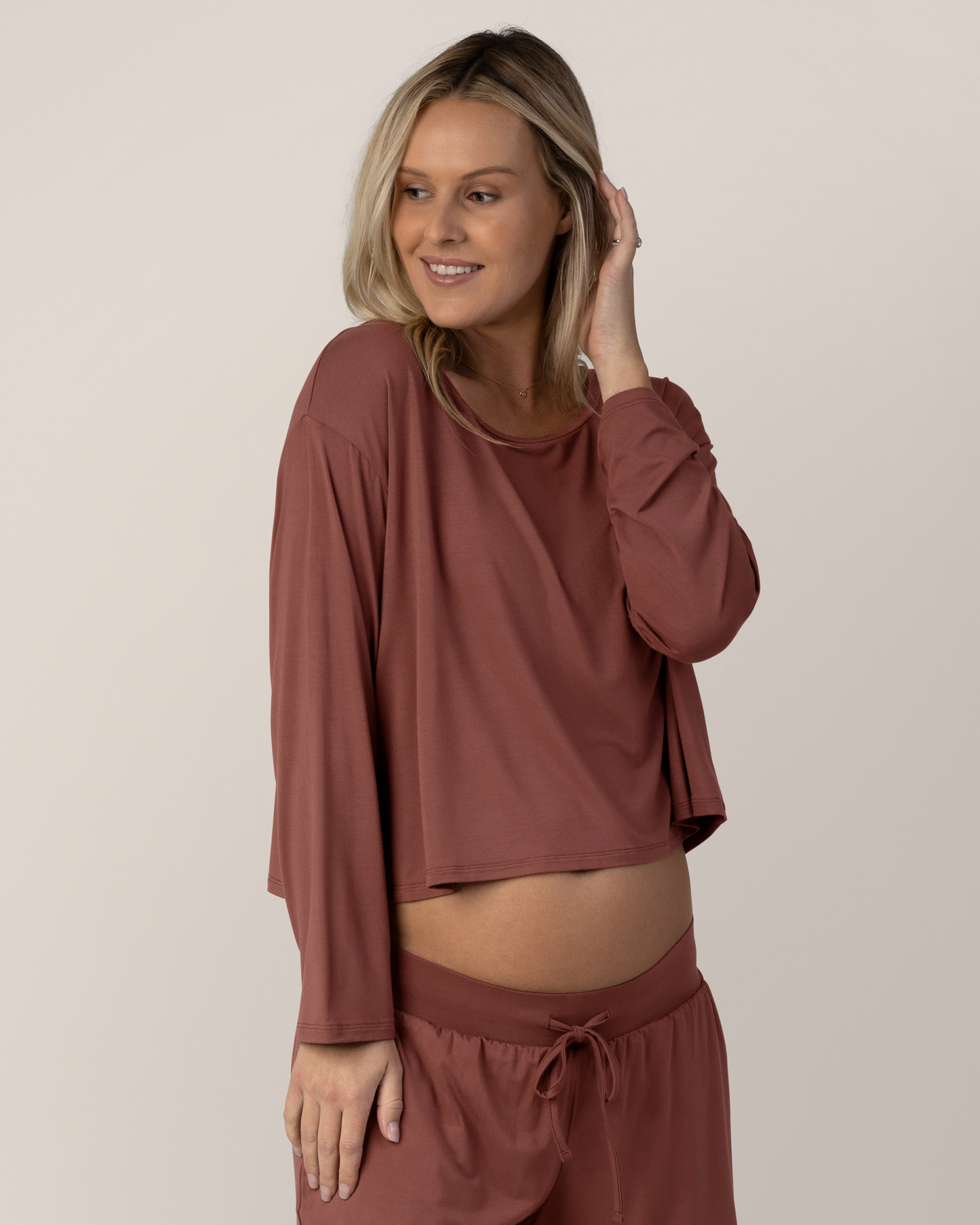 Front view of model wearing the Aria Bamboo Casual Cropped long Sleeve Top in Redwood with the matching Aria Bamboo Casual Lounge Pant @model_info:Maddy is wearing a Small.