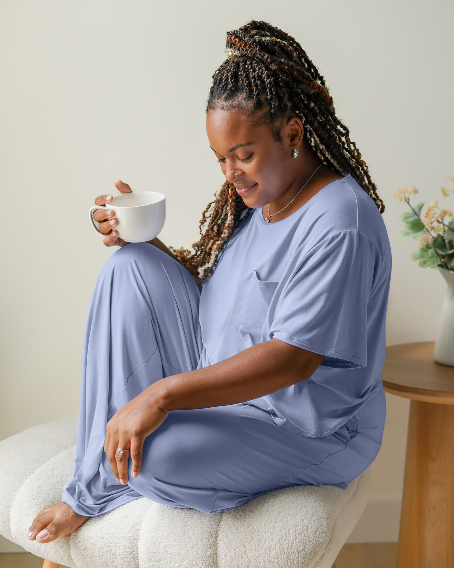 Model sitting wearing the Aria Bamboo Casual Cropped Short Sleeve Top in Periwinkle with the matching Aria Bamboo Casual Lounge Pant