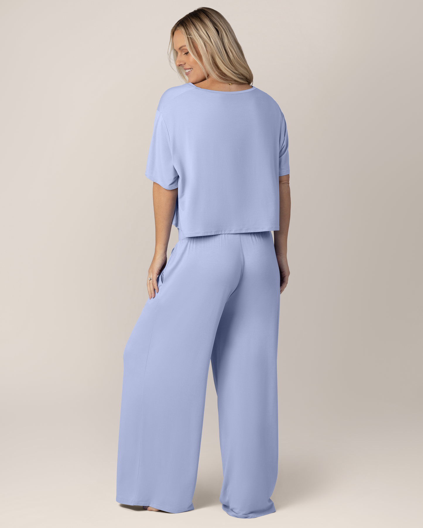 Back view of model wearing the Aria Bamboo Casual Lounge Pant in Periwinkle, paired with matching Aria Bamboo Casual Cropped Short Sleeve Top