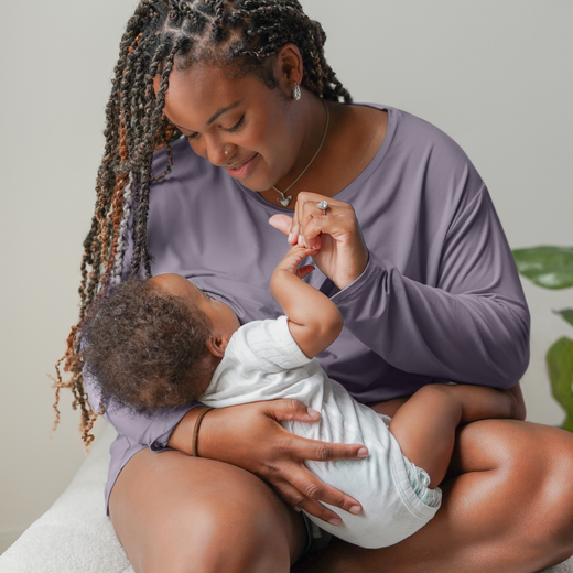 Model nursing baby while wearing the Aria Bamboo Casual Cropped Long Sleeve Top in Granite paired with the matching Aria Bamboo Casual Lounge Short 