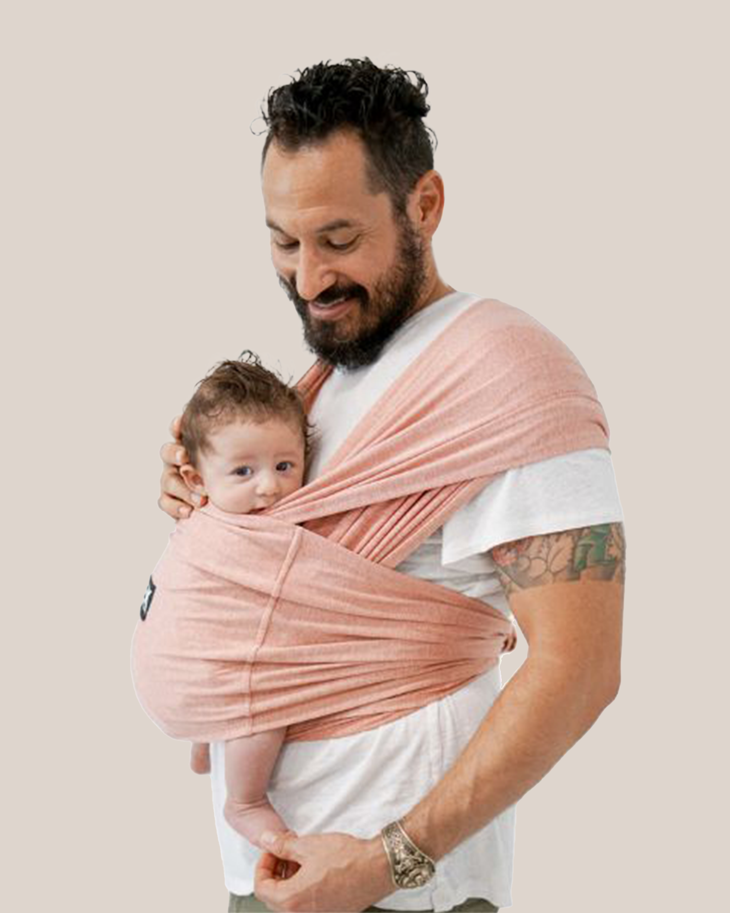 Model wearing baby in the Baby K'tan - Active Yoga Baby Carrier in Heather Coral