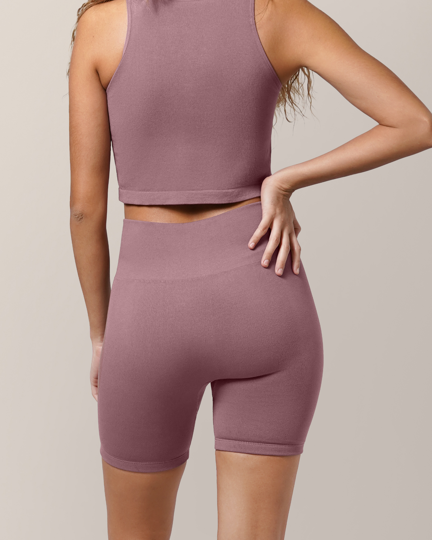 Back view of model wearing the Sublime® Bamboo Maternity & Postpartum Bike Short in Twilight paired with matching Sublime® Bamboo Hands-Free Pumping Longline Bra Top 