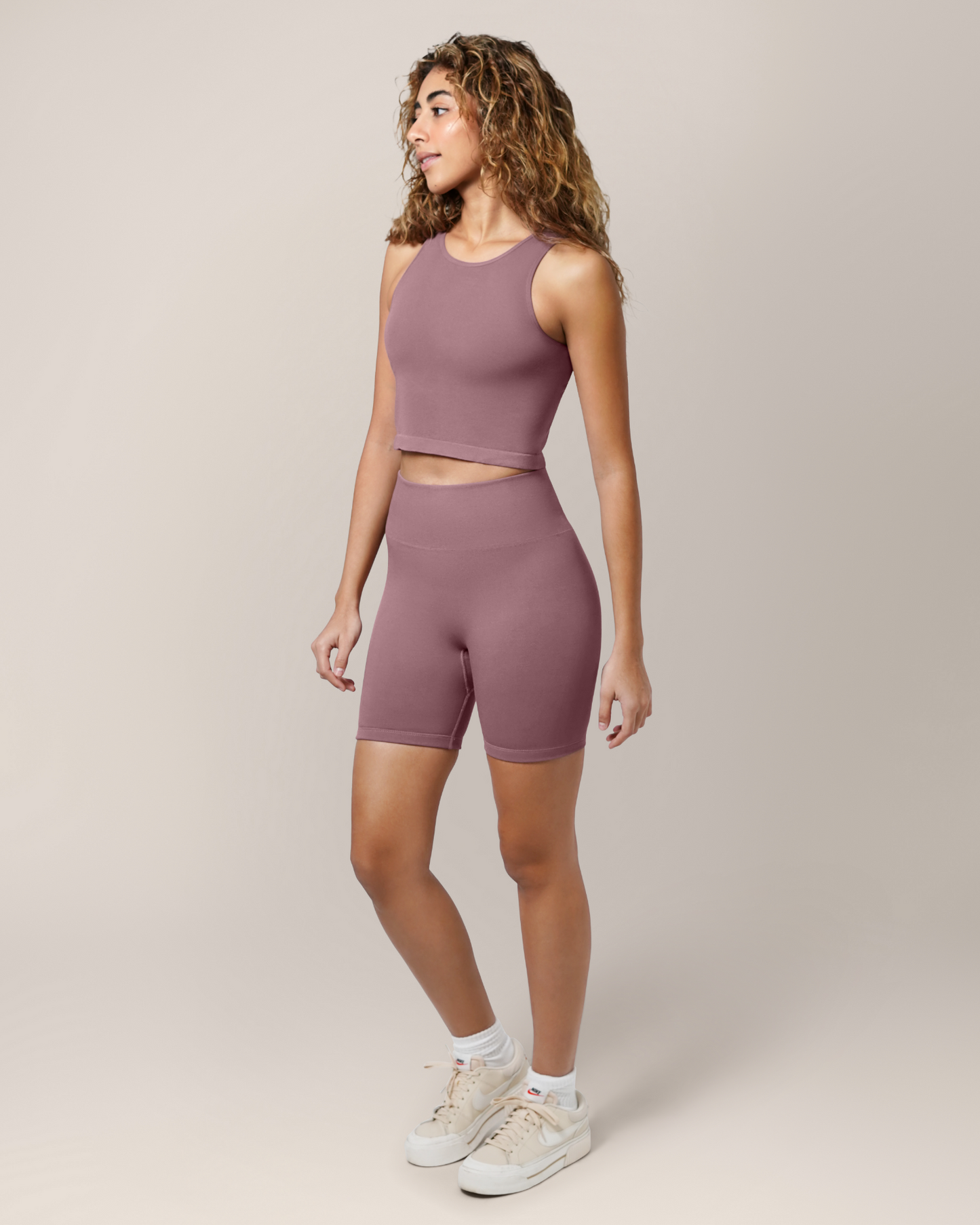 Full body 3/4 angle view of model wearing the Sublime® Bamboo Maternity & Postpartum Bike Short in Twilight paired with matching Sublime® Bamboo Hands-Free Pumping Longline Bra Top