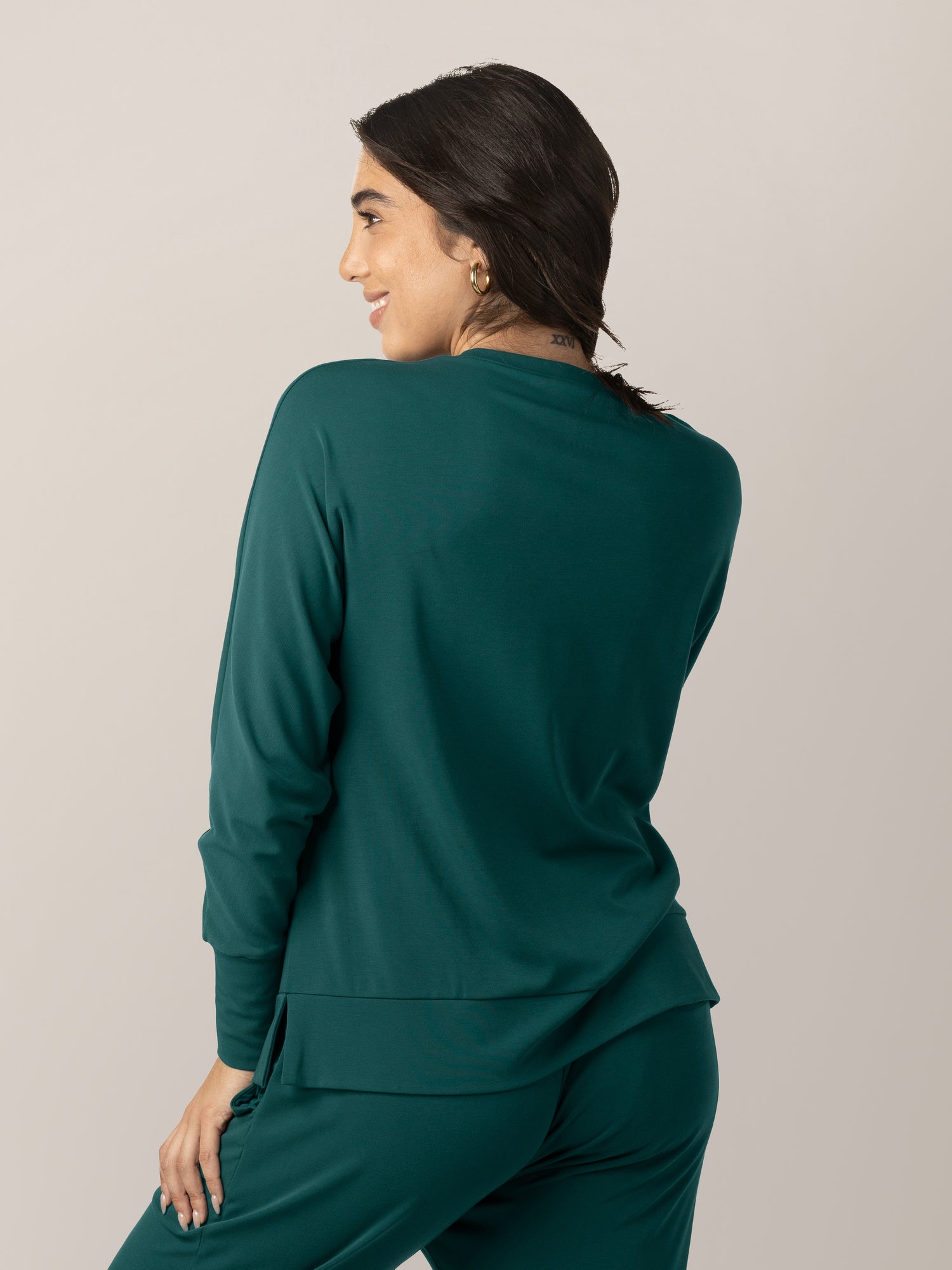 Back view of model wearing the Bamboo Maternity & Nursing Crew Neck Sweatshirt in Evergreen.