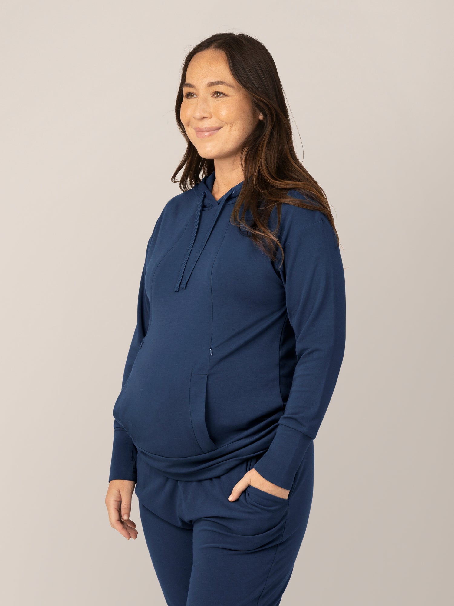 3/4 view of model wearing the Bamboo Maternity & Nursing Hoodie in Navy