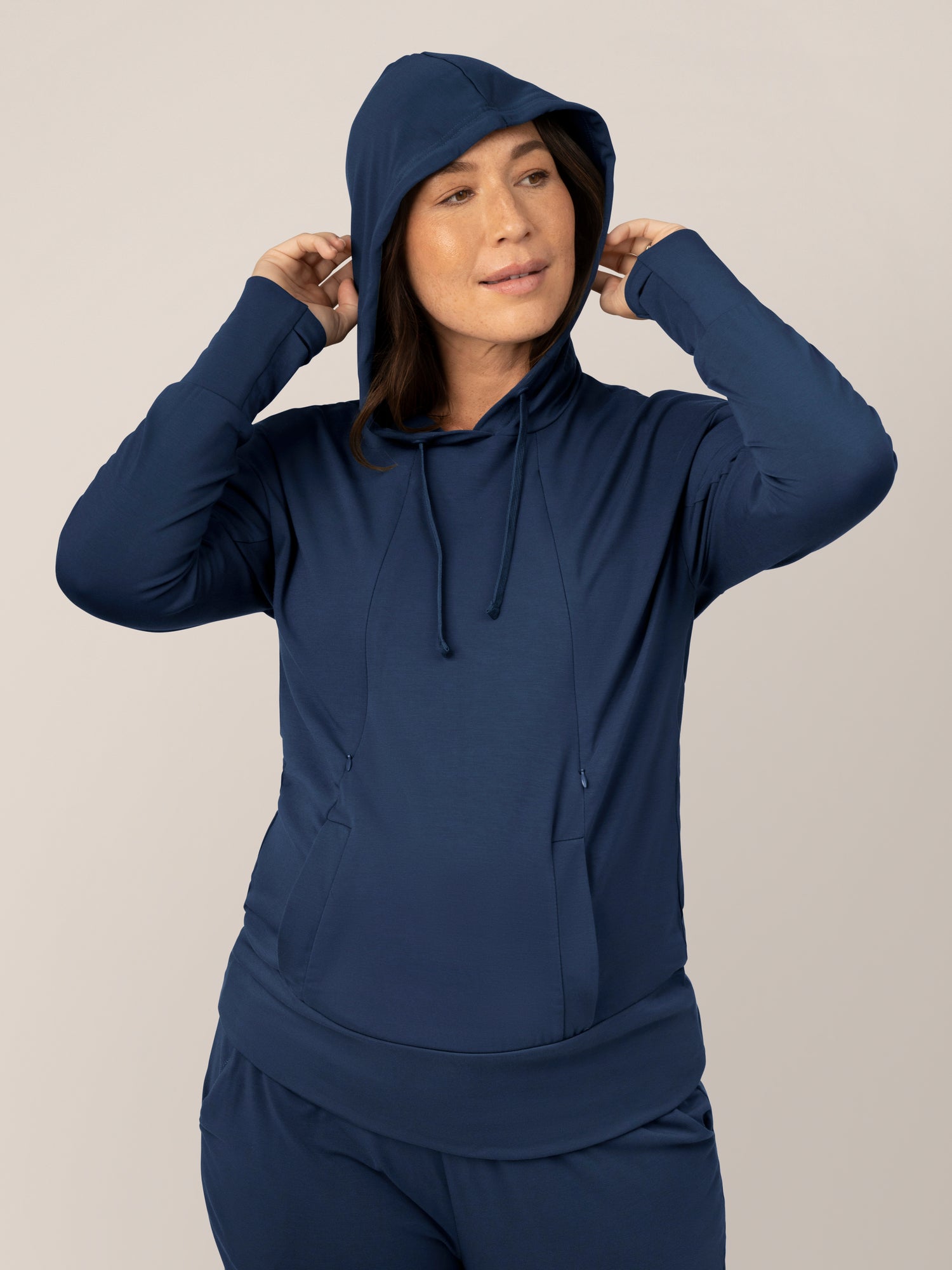 Front view of model wearing the Bamboo Maternity & Nursing Hoodie in Navy with hood on @model_info:Susanna is wearing a Medium.