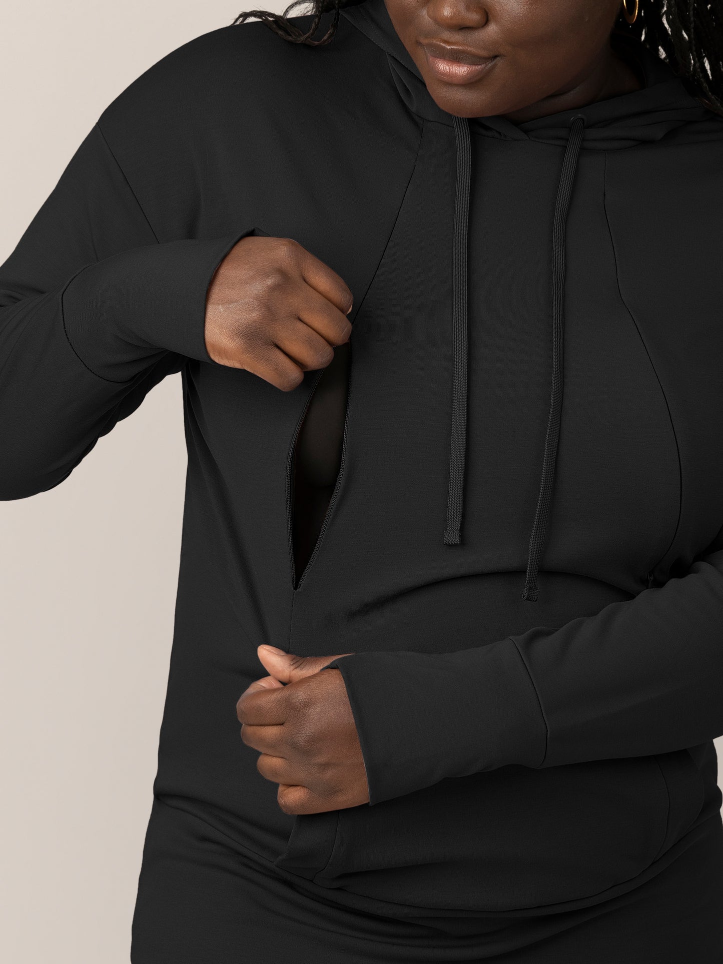 Close up view of model wearing the Bamboo Maternity & Nursing Hoodie in black, showing zipper nursing access