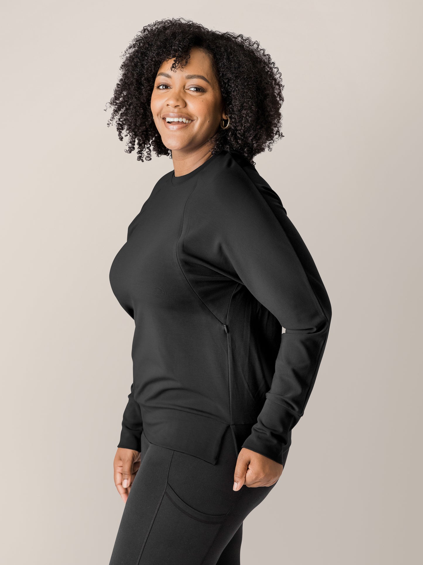 Side view of a model wearing the Bamboo Maternity & Nursing Crew Neck Sweatshirt in Black