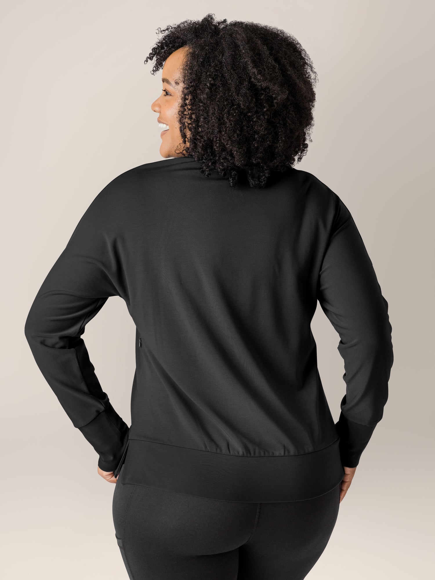 Back view of a model wearing the Bamboo Maternity & Nursing Crew Neck Sweatshirt in Black