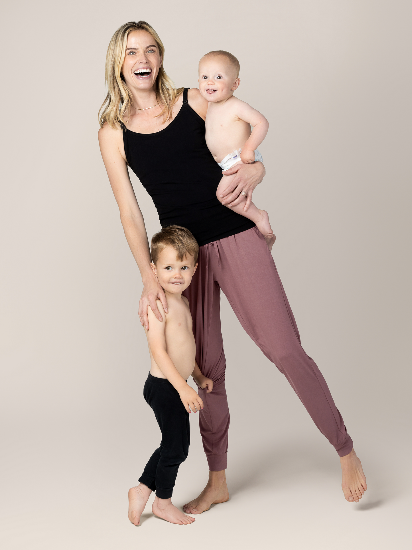 Model playing with kids and wearing the Sublime® Bamboo Hands-Free Pumping & Nursing Camisole in Black