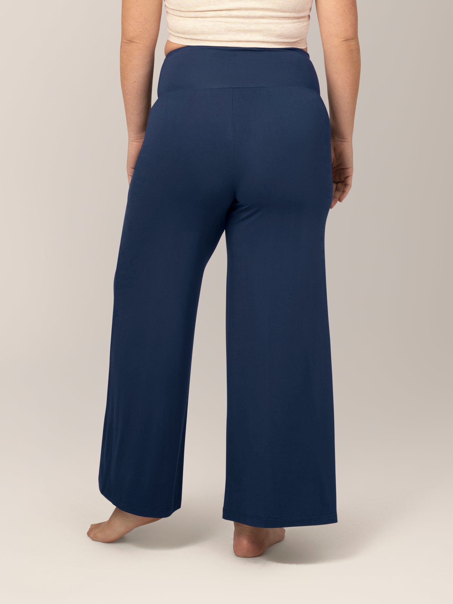 Back view of model wearing the Bamboo Wide Leg Maternity & Postpartum Lounge Pant in Navy