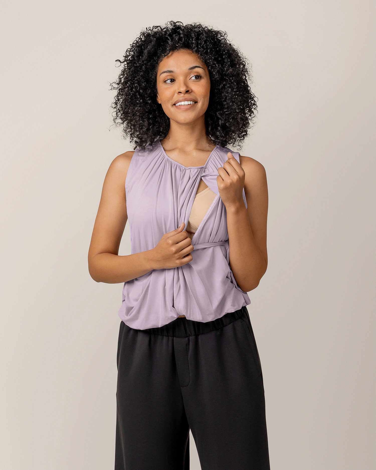 Model wearing the Piper Bubble Hem Nursing Tank in Lavender Mist, showing nursing access