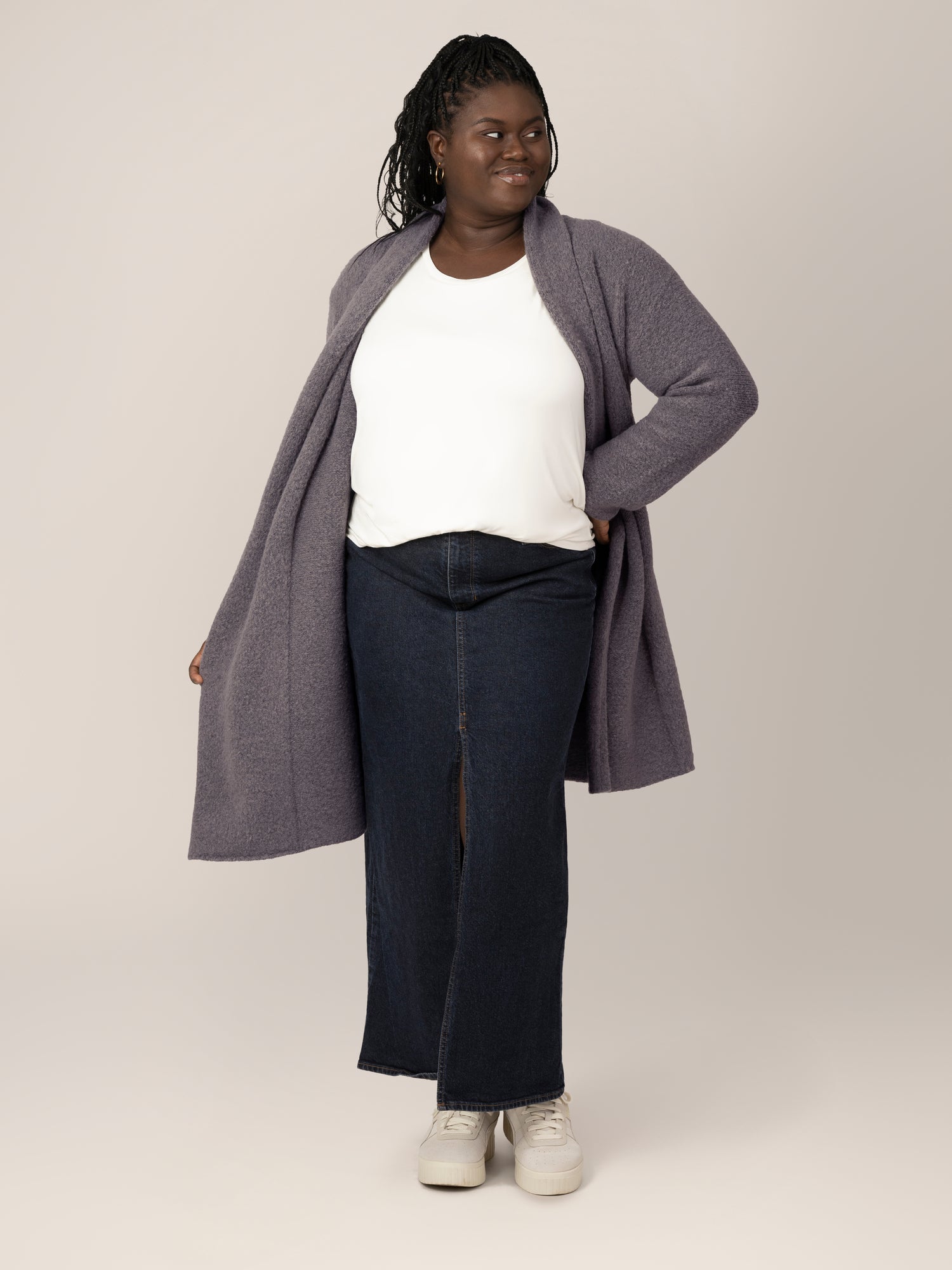 view of model wearing the Chloe Cardigan Sweater in Charcoal, paired with a white t-shirt and long denim skirt.