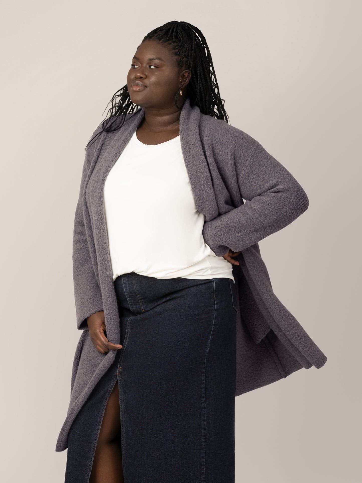 3/4 view of model wearing the Chloe Cardigan Sweater in Charcoal. @model_info:Bintou is wearing an XL/1X.