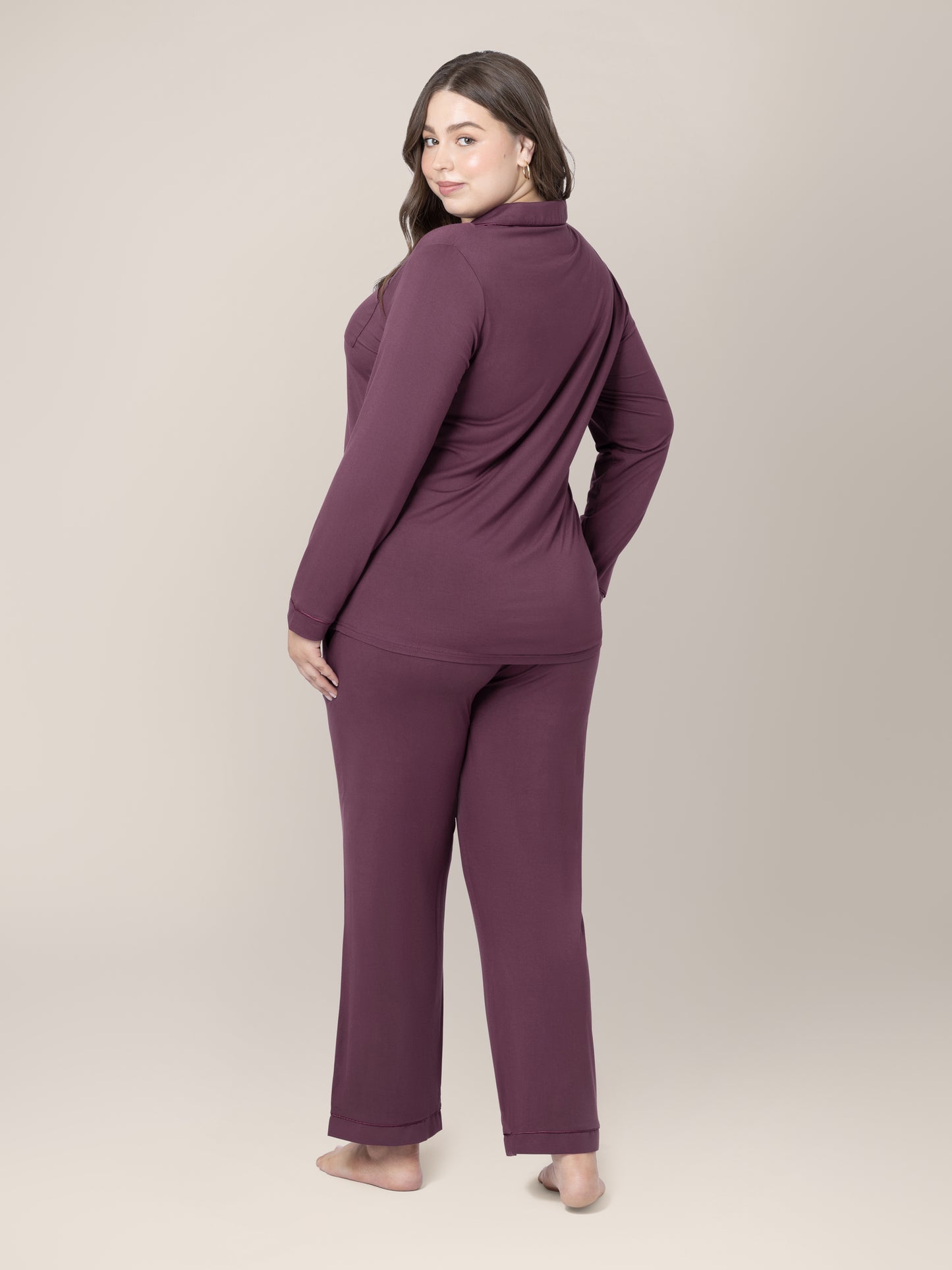 Back view of model wearing the Clea Bamboo Long Sleeve Pajama Set in Burgundy Plum 