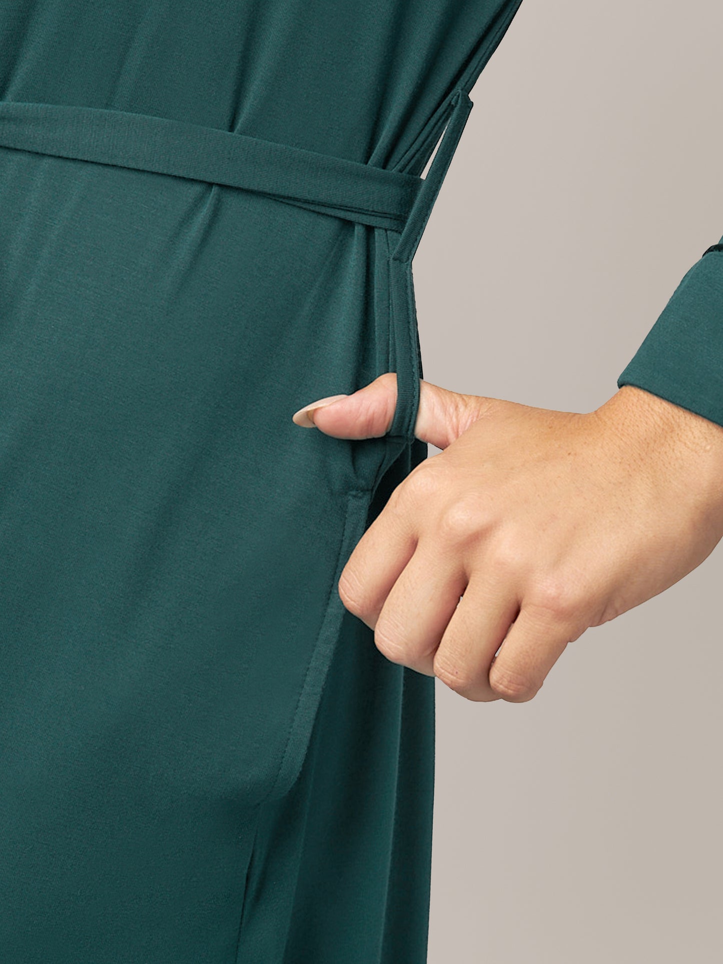 Close up of second belt loop option on the Clea Bamboo Robe in Evergreen, with model's thumb through loop.