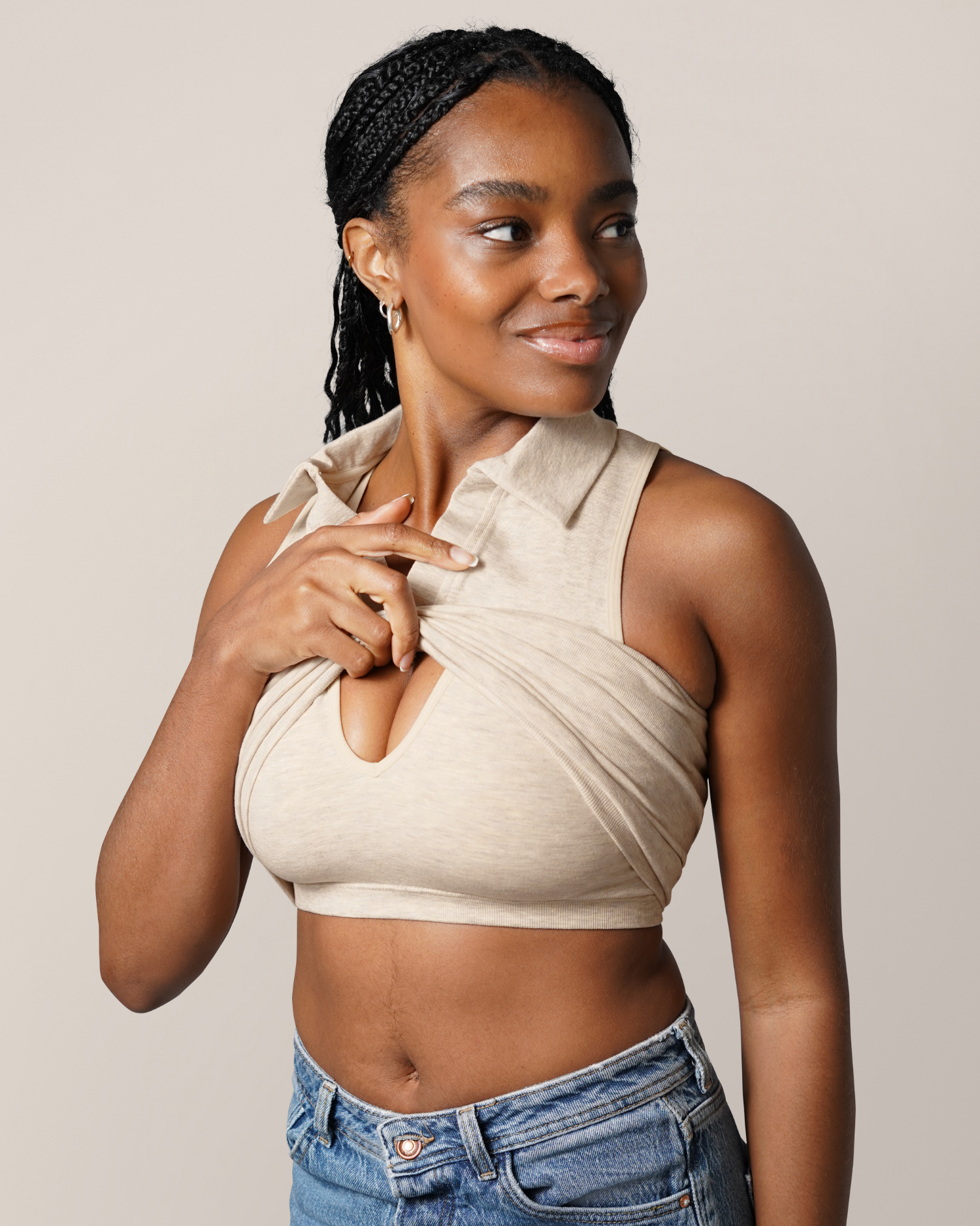 Angled front view of model wearing the Sublime® Bamboo Collared Maternity & Nursing Longline Bra Top in Oatmeal Heather, listing up outer layer to show nursing access; paired with jeans