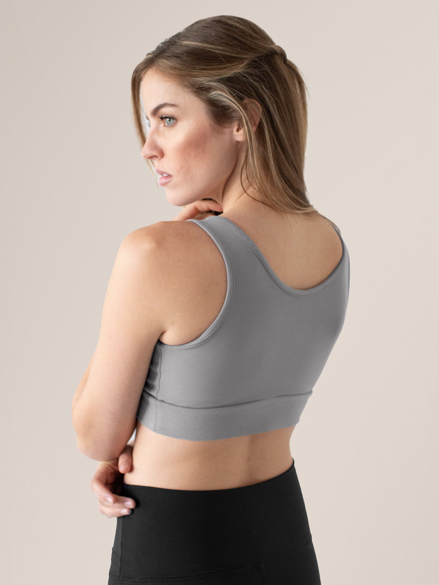 Side back view of model wearing the Organic Cotton Sleep & Nursing Bra in Grey 