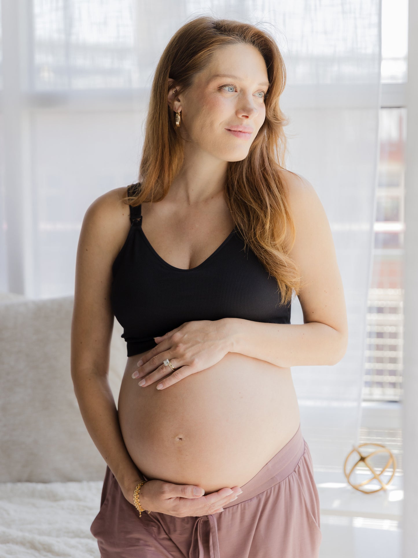 Pregnant model wearing the Mia Maternity & Nursing Lounge Bra in Black. @model_info:Kayla is wearing a Small.