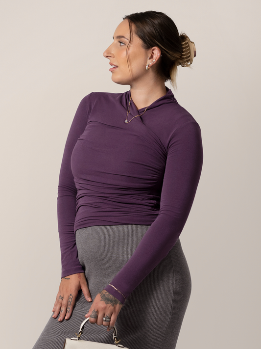 Front view of model wearing the Gianna Shirred Maternity & Nursing Top in Mulberry, with model looking to the side @model_info:Anna is wearing a Medium.