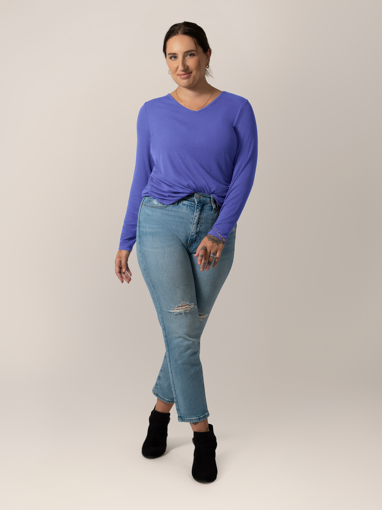 Full body view of model wearing the Ribbed Bamboo Maternity & Nursing Long Sleeve T-shirt in Cobalt, tucked into jeans and also paired with booties