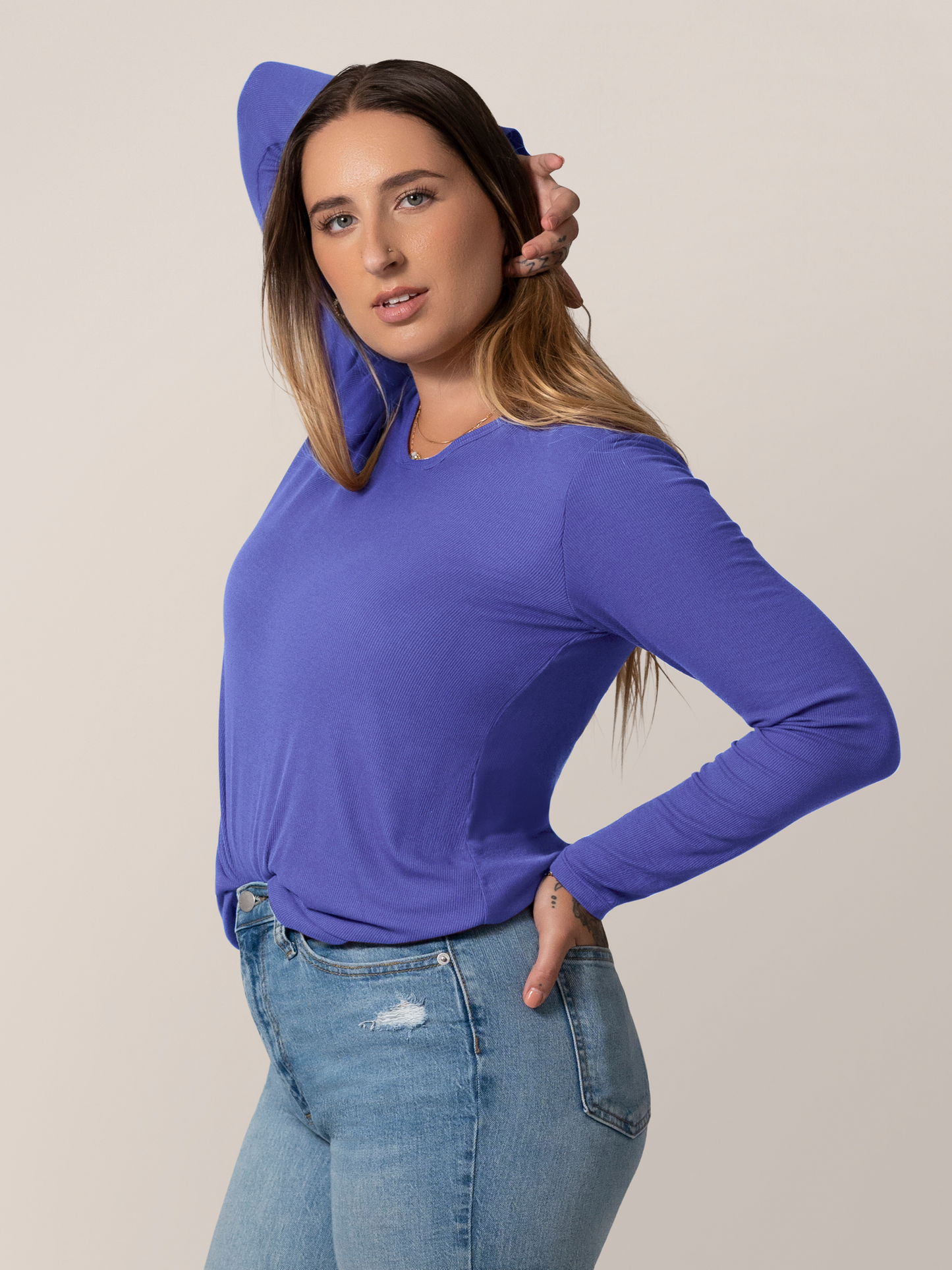 Side view of model wearing the Ribbed Bamboo Maternity & Nursing Long Sleeve T-shirt in Cobalt, with front tuck