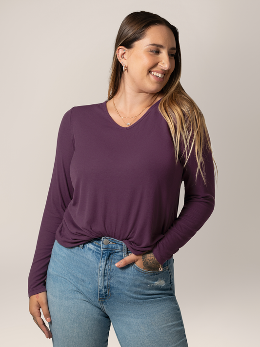 Front view of model wearing the Ribbed Bamboo Maternity & Nursing Long Sleeve T-shirt in Mulberry, tucked into jeans @model_info:Anna is wearing a Medium.