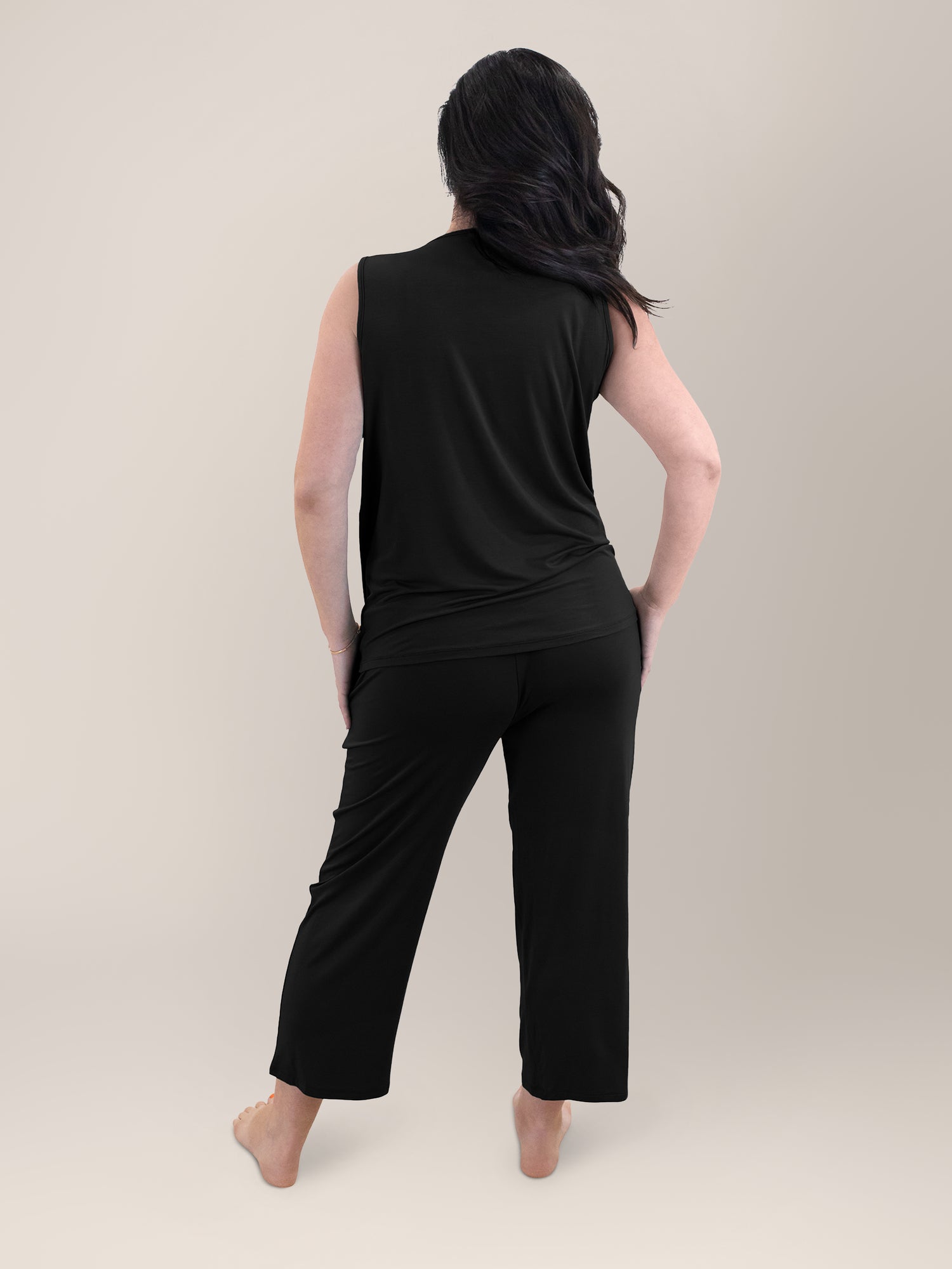 Back view of pregnant model wearing the Tulip Hem Nursing Tank & Capri Pajama Set in Black