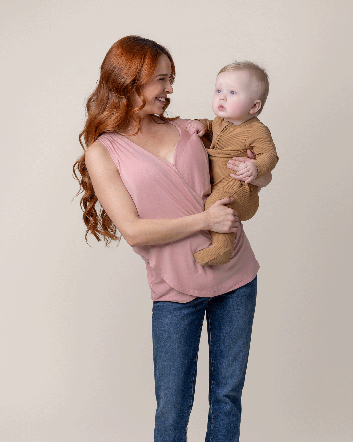 Model holding baby and wearing the Bamboo Draped Nursing Tank in Light Mauve @model_info:Shannon is wearing a Small.