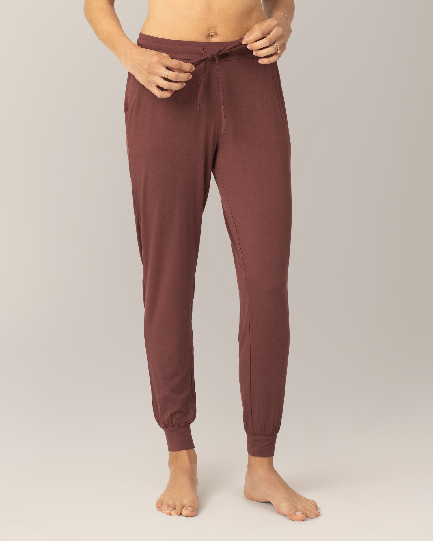 Close up front view of model wearing the Everyday Lounger Jogger in Redwood, showing the drawstring