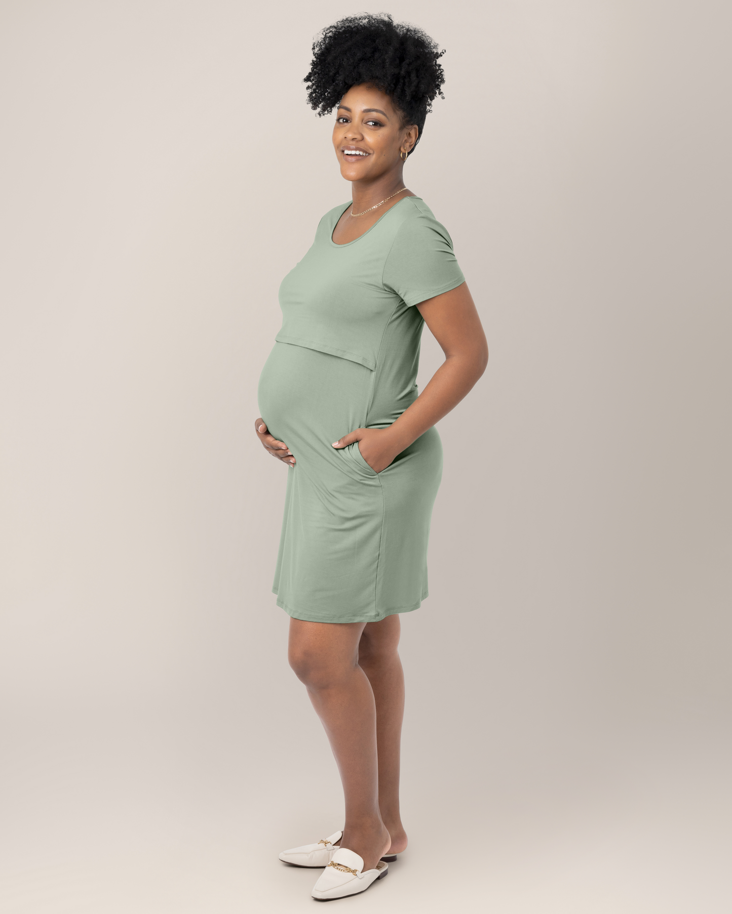 Side view of model wearing the Eleanora Bamboo Maternity & Nursing Dress in Aqua Mist, with hand in pocket 