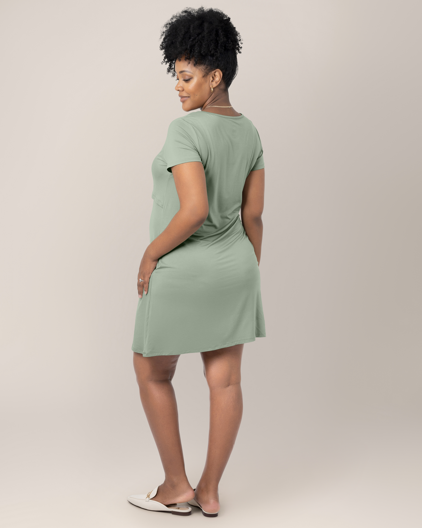 3/4 back view of model wearing the Eleanora Bamboo Maternity & Nursing Dress in Aqua Mist