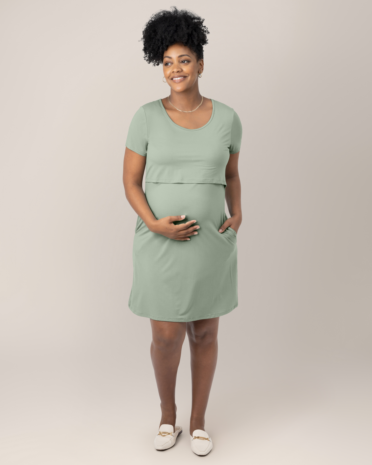 Front view of model wearing the Eleanora Bamboo Maternity & Nursing Dress in Aqua Mist, with hand in pocket @model_info:Roxanne is 5'8" and wearing a Large.