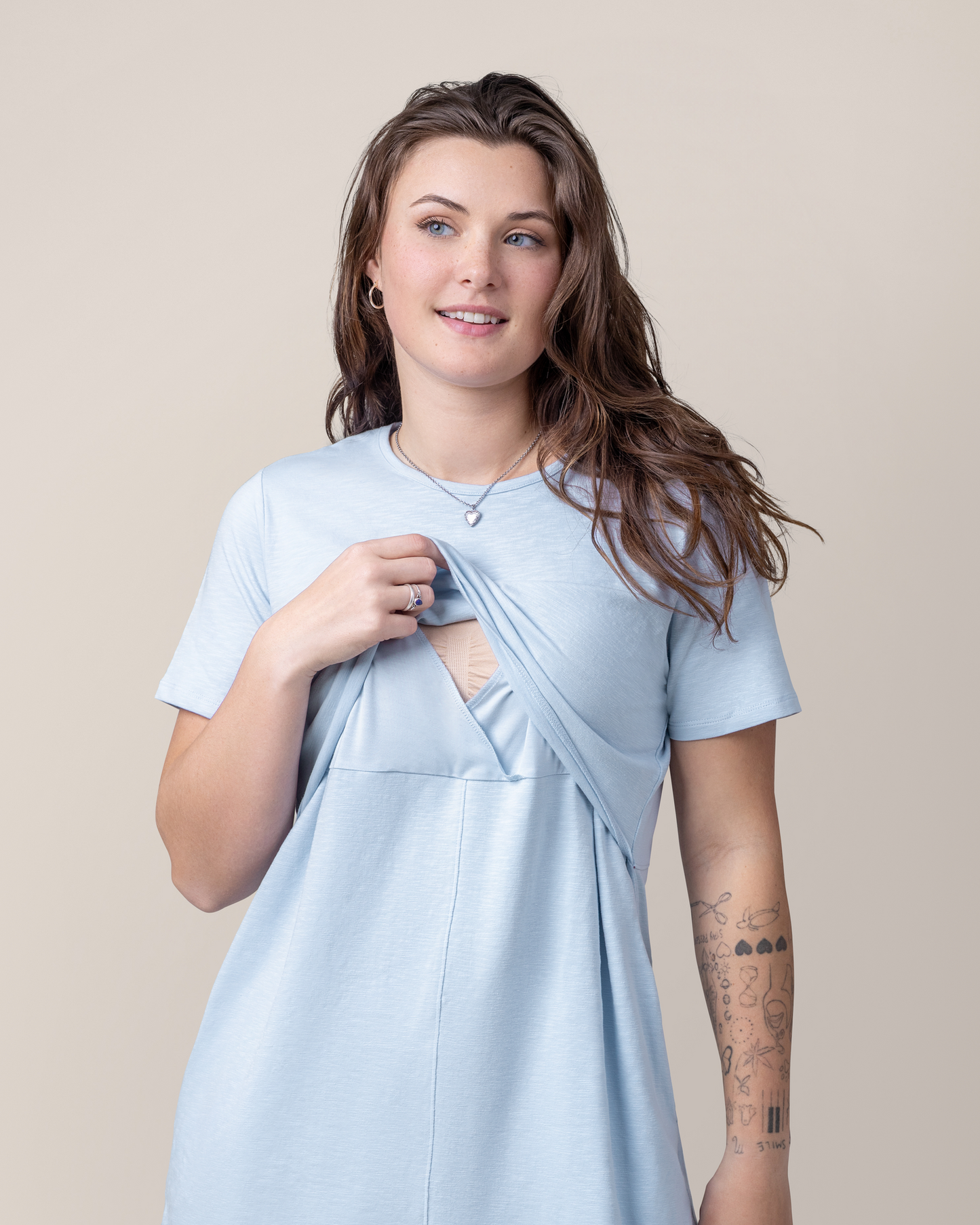 Front view of model wearing the Emmie Nursing T-shirt Dress in French Blue, showing the pull-up nursing access