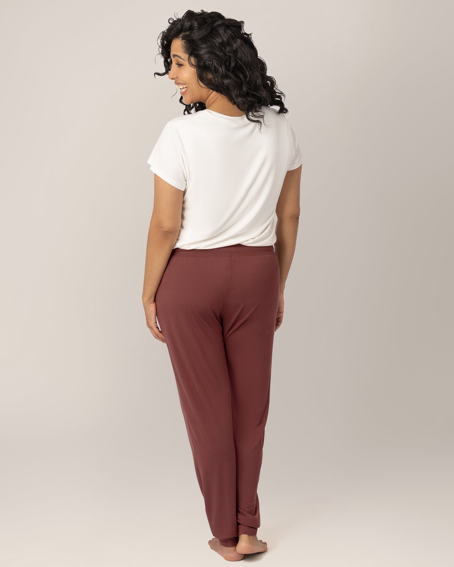 Back view of model wearing the Everyday Lounger Jogger in Redwood.