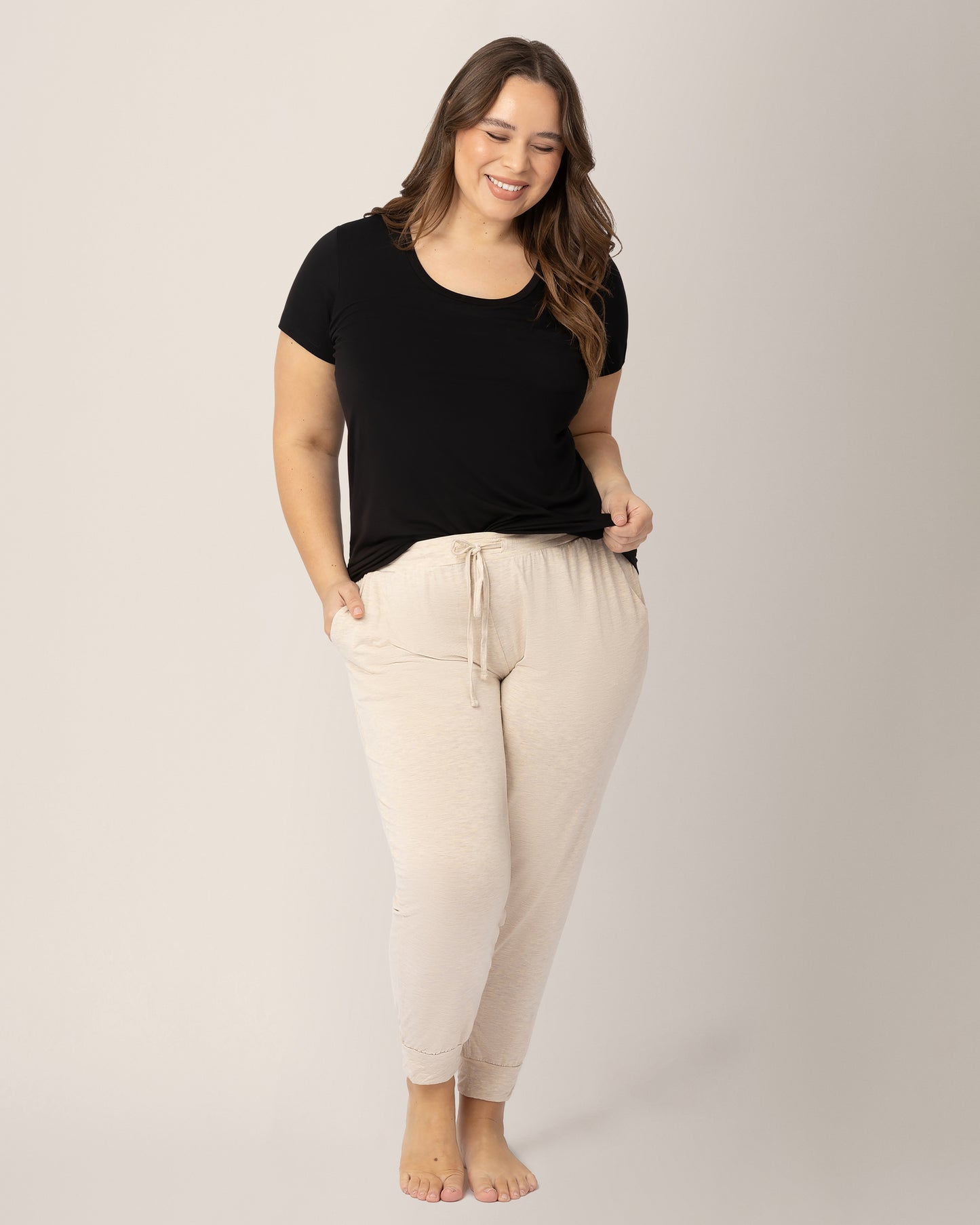 Model wearing the Everyday Lounge Jogger in Oatmeal Heather, paired with the Everyday Maternity & Nursing T-shirt in Black @model_info:Venezia is 5'6" and wearing an X-Large Regular.