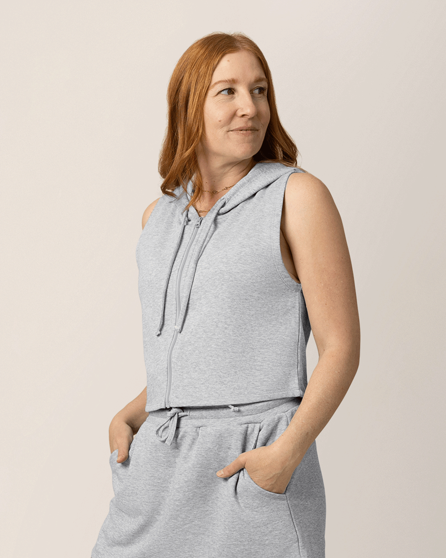 Front view of model wearing French Terry Sleeveless Nursing Hoodie in Grey Heather with matching French Terry On the Go Skort @model_info:Anna is wearing a Medium.