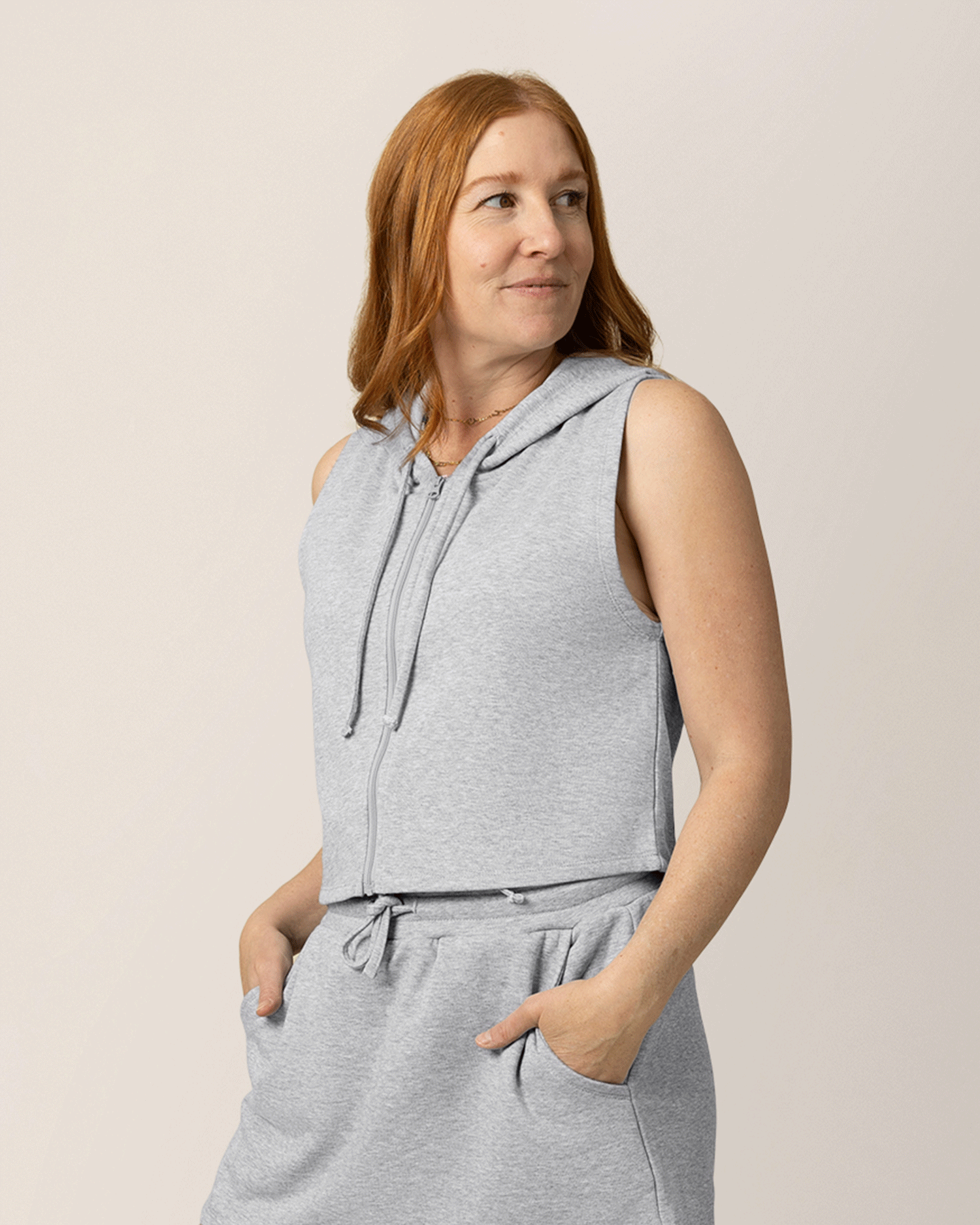 Front view of model wearing French Terry Sleeveless Nursing Hoodie in Grey Heather with matching French Terry On the Go Skort @model_info:Anna is wearing a Medium.