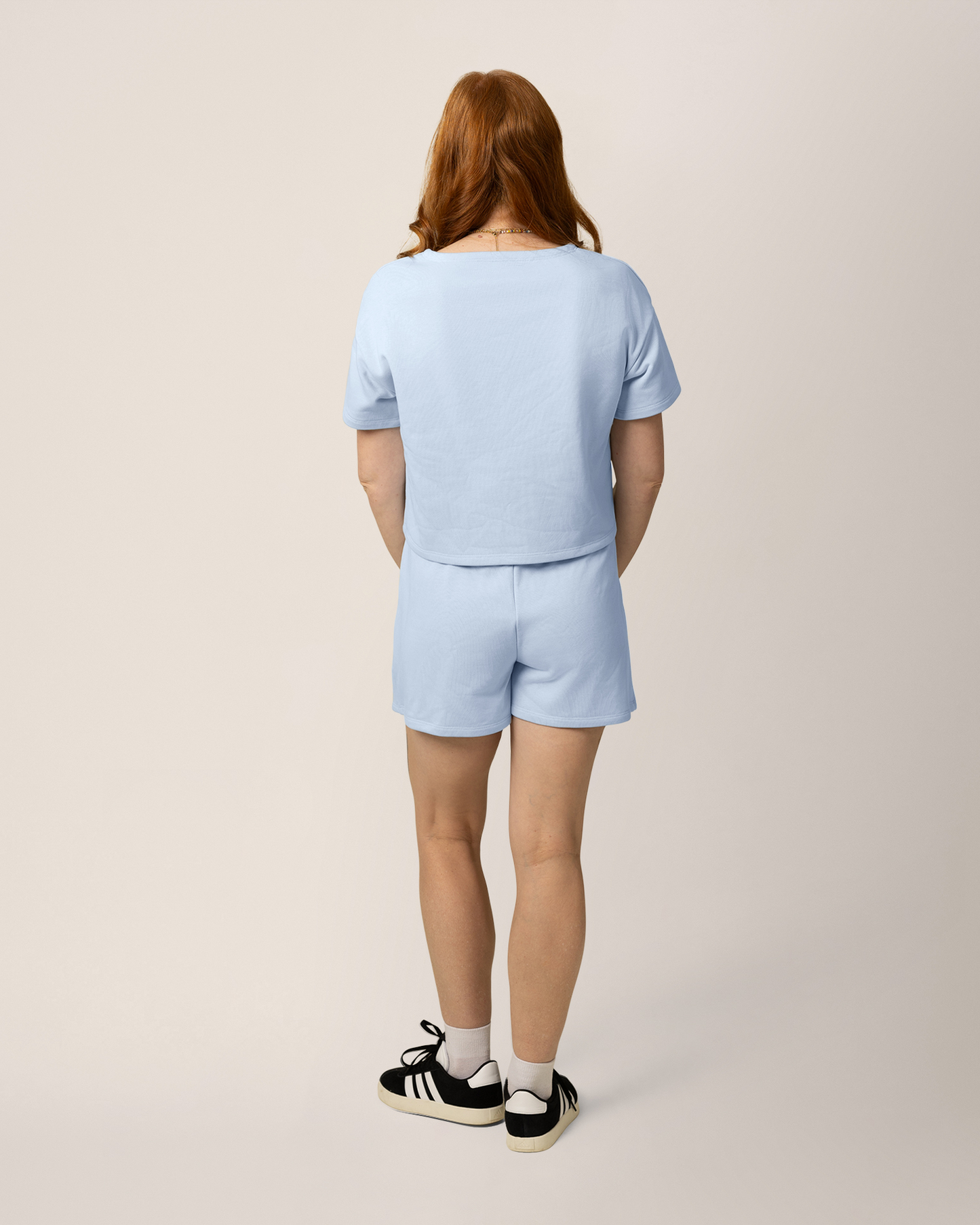 Back view of model wearing French Terry Nursing T-shirt in French Blue with matching French Terry On the Go Skort 